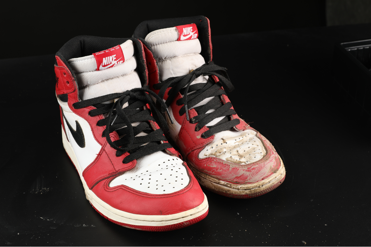 The close-up shot showing Nike sneaker