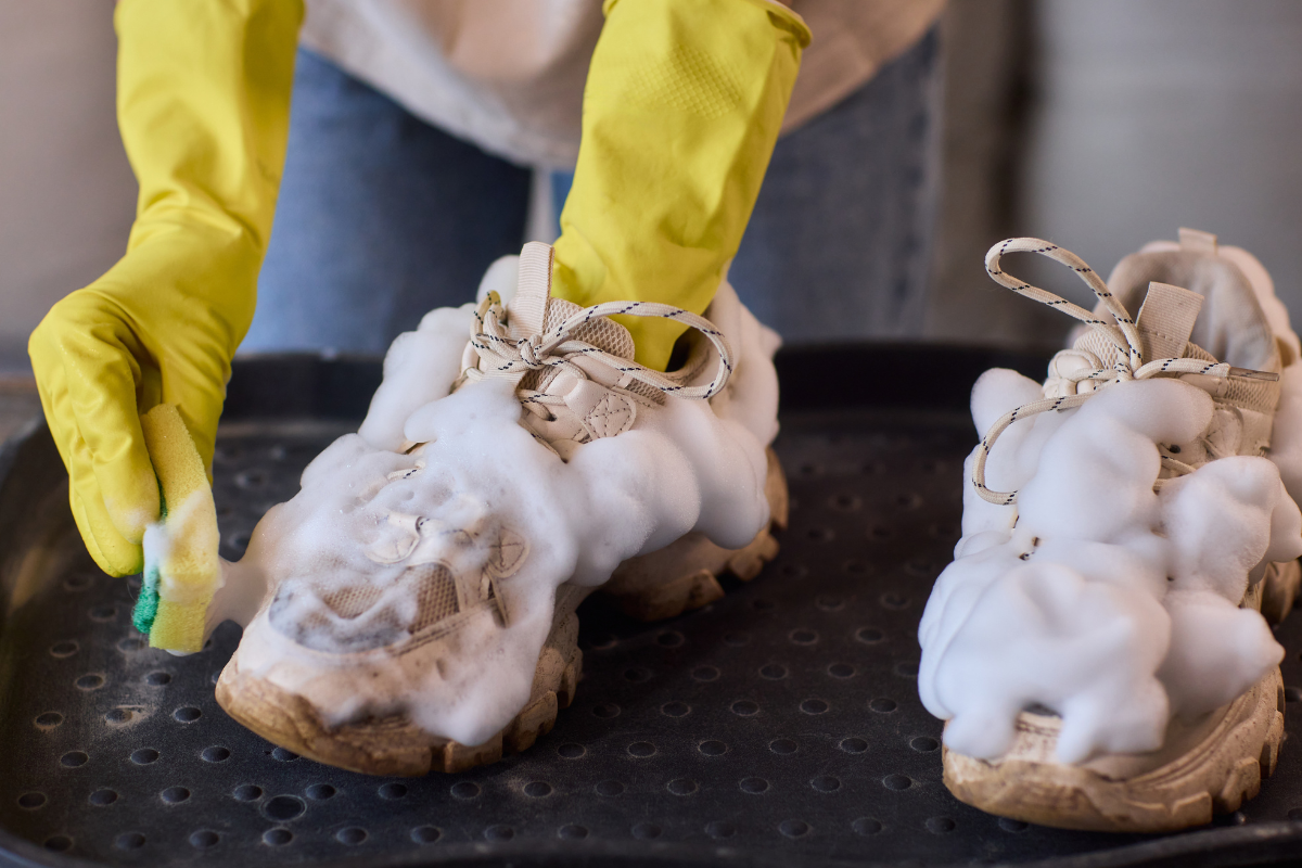 Person is cleaning shoes