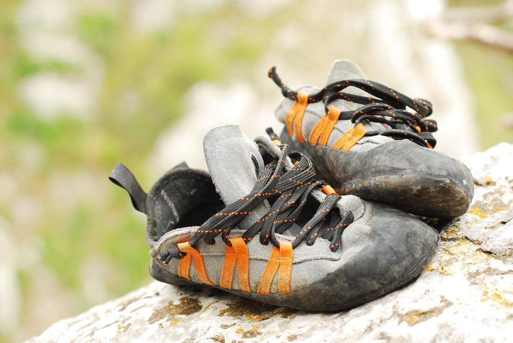 pair of dirty climbing shoes