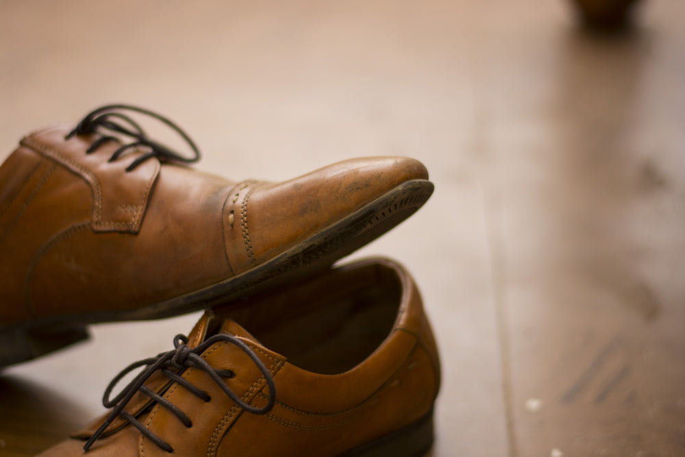 pair of dirty dress shoes