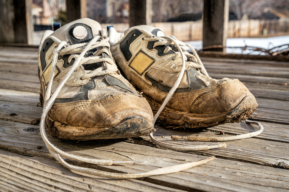 pair of dirty running shoes